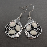 Boucles d'oreilles vintage en pierre blanche