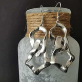 Boucles d'oreilles vintage en argent irrégulières
