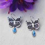 Boucles d'oreilles papillon vintage en argent et pierre bleue