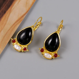 Boucles d'oreilles vintage en pierre noire et or