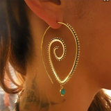 Boucles d'oreilles vintage en spirale dorée avec zircone verte
