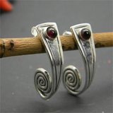Boucles d'oreilles vintage en spirale avec pierre rouge
