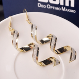 Boucles d'oreilles vintage en spirale en or et zircone