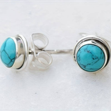 Boucles d'oreilles vintage incrustées de pierres bleues