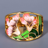 Bague vintage en forme de fleur en émail doré