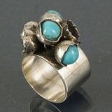 Bague vintage en argent incrustée de pierres bleues