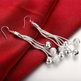 Boucles d'oreilles pendantes vintage en perles d'argent
