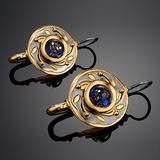 Boucles d'oreilles vintage en cristal bleu arrondi et or
