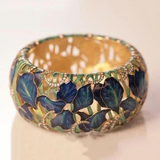 Bague vintage bleue à fleurs dorées