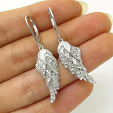 Boucles d'oreilles en argent avec ailes brillantes