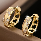 Boucles d'oreilles créoles dorées ajourées avec brillant