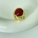 Bague ajustable vintage en or texturé et pierre rouge