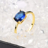 Bague vintage en or ovale avec pierre précieuse bleue et élégante