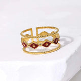 Bague ajustable à plusieurs bandes en or et pierre rouge