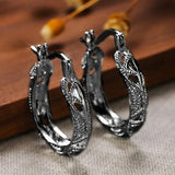 Boucles d'oreilles vintage noires en forme de feuilles creuses