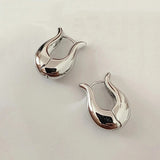 Boucles d'oreilles vintage élégantes en argent incurvées