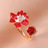 Bague ouverte vintage avec fleur rouge et pierre précieuse rouge éclatante