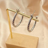 Boucles d'oreilles créoles vintage en argent torsadé