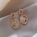 Boucles d'oreilles vintage en or et cristal ovale