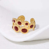 Bague vintage ajustable en or et pierre rouge