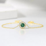 Bracelet vintage en or avec cristaux verts et bordure pavée