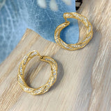 Boucles d'oreilles en cristal torsadé doré