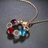 Collier avec pendentif cercle en cristal coloré et or rose