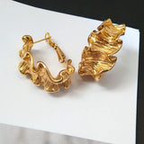 Boucles d'oreilles créoles ondulées à volants dorées