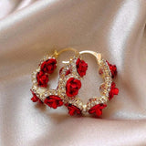 Boucles d'oreilles créoles en or et cristal rose