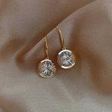 Boucles d'oreilles pendantes rondes dorées scintillantes