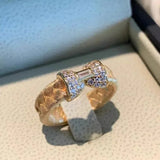Bague rétro ajustable en or et cristal baguette avec nœud