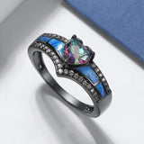 Bague avec pierre précieuse noire en forme de cœur et émail bleu