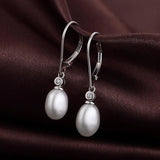 Boucles d'oreilles pendantes en argent avec perles ovales