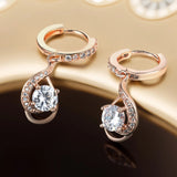 Boucles d'oreilles pendantes en cristal et or rose