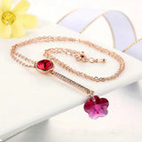 Collier vintage en or rose avec pendentif en cristal rouge et fleur