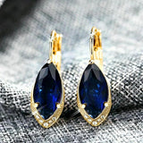Boucles d'oreilles vintage en or et cristal bleu marine
