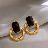 Boucles d'oreilles créoles en or et pierres précieuses ovales noires