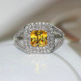 Bague vintage classique avec pierre jaune et halo en argent