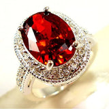 Bague halo ovale en argent avec pierre précieuse rouge