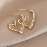 Boucles d'oreilles créoles cœur pavées de cristaux dorés