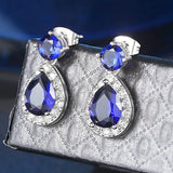 Boucles d'oreilles vintage avec pierres précieuses bleues et pierres blanches éclatantes