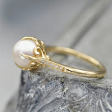 Bague vintage en or avec perle centrale