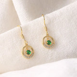 Boucles d'oreilles vintage en or vert et pierre scintillante