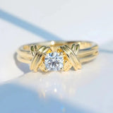 Bague en or en forme de X avec zircone ronde