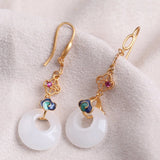 Boucles d'oreilles vintage en or blanc et jade rond avec pompons