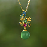 Collier vintage avec pendentif papillon en cristal et fleurs dorées