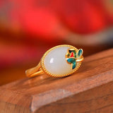 Bague ajustable classique en or avec pierre précieuse ovale et motif floral