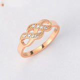 Bague vintage en or rose avec nœud infini torsadé
