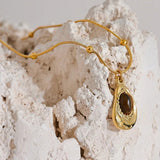 Collier vintage avec pendentif en pierre œil-de-tigre