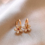 Boucles d'oreilles créoles vintage en or et cristal